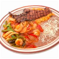 Shrimp with Carne Asada · Grilled carne asada and shrimp served with rice, beans and tortillas.