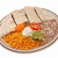 Quesadilla Plate · Flour tortilla stuffed with cheese and choice of meat. Served with rice, beans, sour cream, ...
