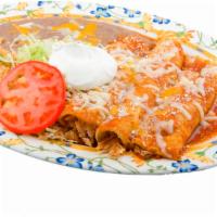 Enchilada Plate · 3 enchiladas in red sauce stuffed with choice of meat and topped with melted cheese, sour cr...