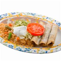 3 Taquito Plate · 3 rolled corn torilla taquitos stuffed with shredded beef and potatoes. Served with rice, be...