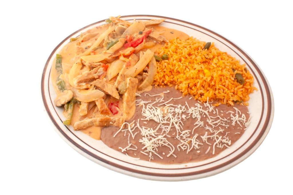 Pollo ala Crema · Grilled chicken breast and sauteed vegetables cooked in a creamy sauce. Served with rice, beans, and tortillas.