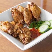 A7. Fish sauce wings (Ga chien nuoc mam) (4 pc) · Want more wings?