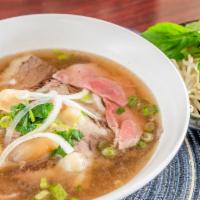 P5. Pho special (Pho dac biet) · Combination rice noodle soup with steak, brisket, beef balls, fatty flanks, soft tendons, an...