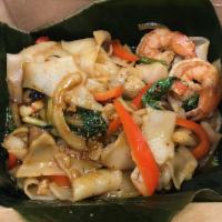 Drunken Noodles Seafood · Shrimp and Scallops. Wide rice noodles with Thai chilies, onions, mushrooms, and basil. Spicy 