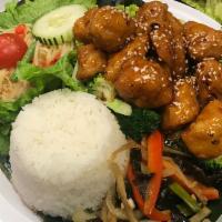 Crispy Chicken · Tender fried chicken with a tangy spicy sauce, broccoli, and dried chilies. Served with rice 
