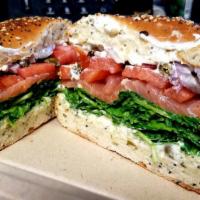 Lox Bagel Breakfast · Served with everything bagel, herbed cream cheese, arugula, tomatoes, smoked salmon, capers ...