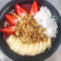 Acai Bowl · Topped with fresh sliced bananas, strawberries, coconut flakes and crunchy granola.