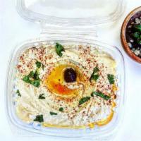 Hummus & Pita · House-made, Smooth, Creamy Hummus served with warm Pita