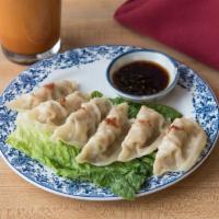 79. Steamed Chicken Dumplings · 6 pieces of chicken dumplings with sweet soy dipping sauce.