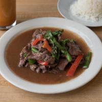 111. Pad Kra Prow · Sauteed choice of meat in a spicy Thai basil leaf and green bean sauce. Served with a scoop ...