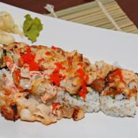 Dynamite California Roll · Seafood scallop, mix crab, tuna, salmon, albacore mix baked with spicy mayonnaise sauce on a...