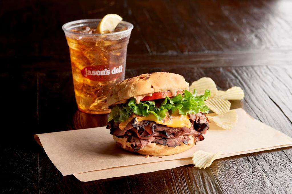 Big E's Deli Burger · Hot roast beef, American cheese, 1000 Island dressing, leafy lettuce, tomato and toasted onion bun.