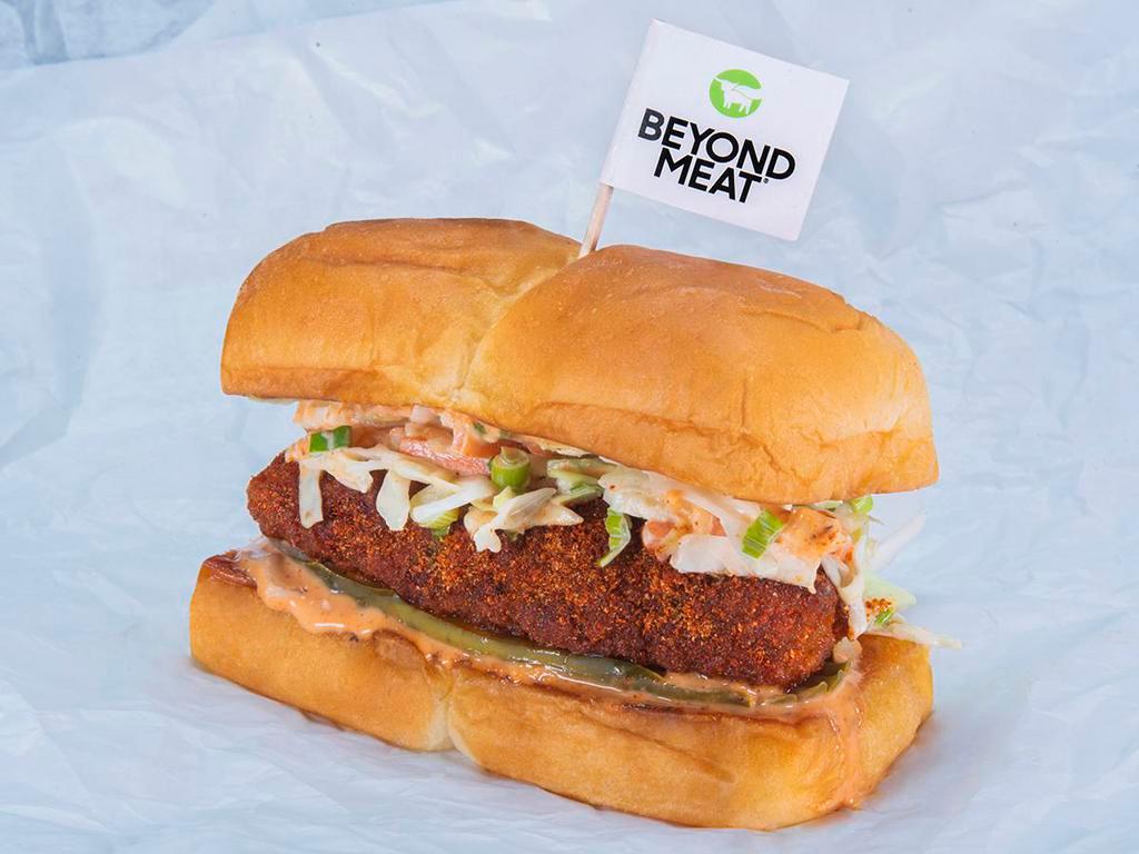Beyond® The Hot Chick Slider · Crispy fried Beyond® tender, spiced to your liking, Plain, Nashville Hot or Nashville Hotter with secret sauce, dill pickle slices and slaw; served on King's Hawaiian rolls