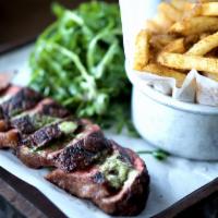 Steak and Fries Plate · Sirloin strip steak, compound herbed butter, Laurel Tavern fries, and arugula salad.