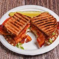 BLT Sandwich · Hickory smoked bacon piled high with shredded lettuce tomato and mayo on honey wheat 8 grain.