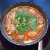 Tom Yum Soup · Thai hot and sour soup; chili sour broth with lemongrass, galangal, mushrooms, tomato, lime ...