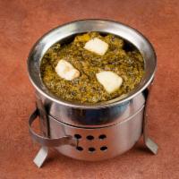 Palak Paneer · Homemade paneer cooked in a creamy sauce of spinach and spices and garnished with fresh cila...