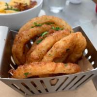 Vodka Battered Onion Rings · Hand cut vodka battered onion rings served with beer honey mustard.