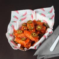 Hot Wings · Made with a premium blend of aged Cayenne pepeprs and topped with jalapenos.