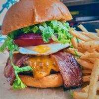 The Triple Bypass Burger · Bacon, cheddar, fried egg, tomato, red onion, Sriracha mayo, on challah. Choice of side.