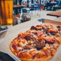 Meat Lovers Pizza · house smoked brisket, house grilled chicken, pepperoni, real Italian sausage, chopped red on...