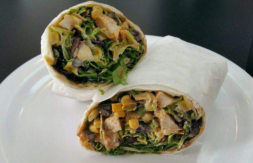 BBQ Chicken Wrap · Grilled chicken, corn, black beans, greens, BBQ buttermilk dressing, tortilla strips and drizzled with BBQ sauce.