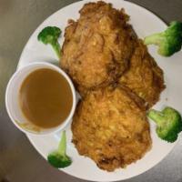 36. Shrimp Egg Foo Young · Served with white rice and 3 cakes.