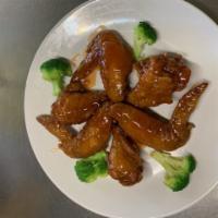 S2. Six Pieces Chicken Wings · Hot and spicy.