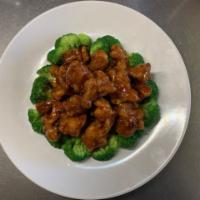 A1. General Tso's Chicken · Chunk of chicken breaded and deep fried in an amazing sweet spicy sauce bedded with fresh br...