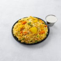 Vegetable Rice Biryani · Saffron basmati rice cooked with fresh seasonal vegetables, peas and nuts.