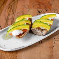 Avocado Toast · Multigrain bread toasted, with tomatoes, eggs, and avocado.