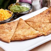 Cheese Pizzadilla · Served with sour cream and avocado.