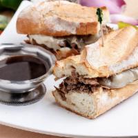 Italian Beef Sandwich · With provolone, mayo and a side of au jus on baguette. Served with your choice of side and a...