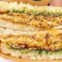 Chicken Tikka Sandwich · Sourdough Bread, Chicken Tikka with Magic Seasoning, Onions, & Mint Chutney