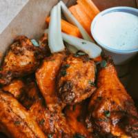 Chicken Wings · Your choice of classic Buffalo, BBQ or honey-Sriracha. Served with blue cheese, carrots and ...