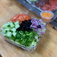 Garden Salad · Green Salad w/ Cuccumbers, Tomatoes, Green Peppers, Onions, & Black Olives.  Served with a s...