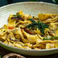 Koko Vegan Pasta · Pappardelle pasta in a Cashew raiso sauce with island spices, shiitake mushrooms and mixed v...