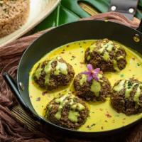 Lentil Meatballs (V) · Caviar lentils rolled with quinoa and tofu in a Trinidadian ginger coconut curry sauce