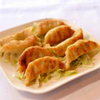 Fried Pork and Vegetable Posticker · 8 pieces.