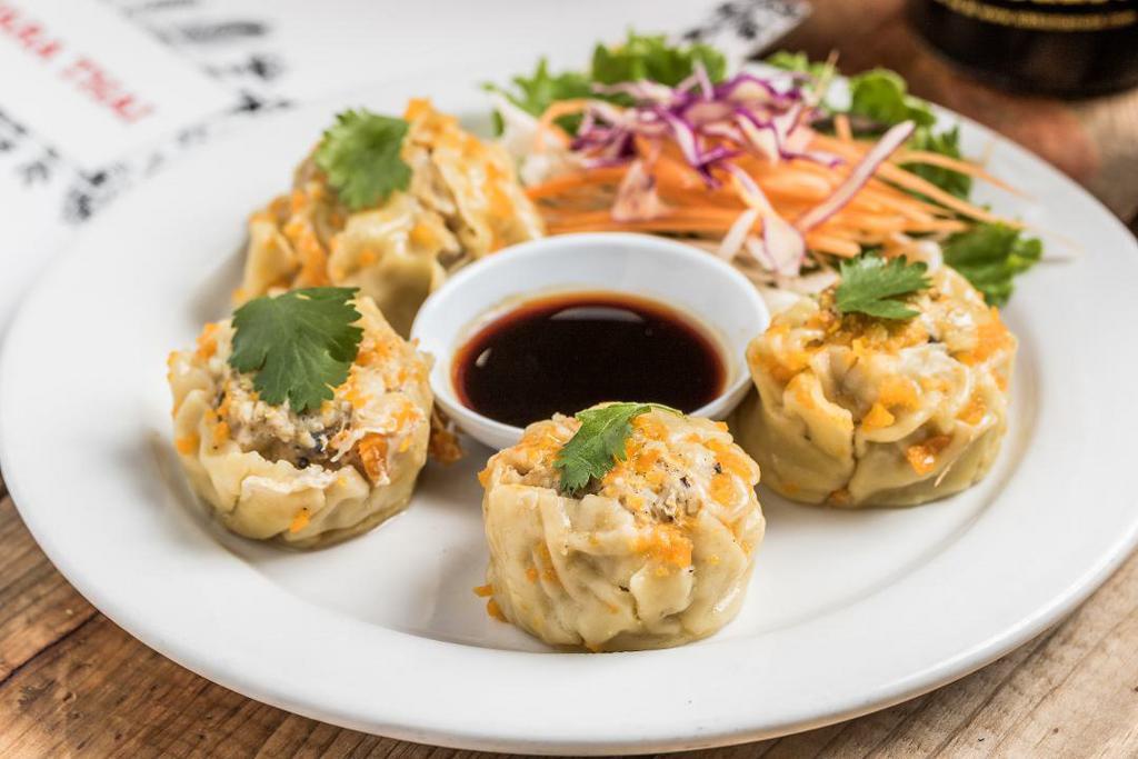 Thai Dumpling · 4 dumplings made with chicken, shrimp, mushrooms, and water chestnuts served with a soy vinegar sauce