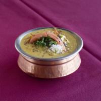 Chicken Coconut Curry · Boneless chicken cooked with coconut milk, tomato, onion, cashew nuts, raisins and curry spi...