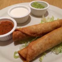 Appetizer Taquitos · 2 pieces. 2 flautas wrapped in corn tortillas rolled around a chicken filling and lightly fr...