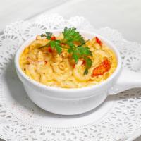 Lobster Mac and Cheese · Sweet Maine lobster meat, Gruyere and Vermont cheddar, elbow macaroni.