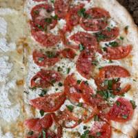 Margherita Pizza · Fresh mozzarella, basil, fresh tomatoes, garlic and oil.