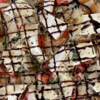 Chicken Gourmet Pizza · Chicken cutlet, fresh mozzarella, basil, balsamic glaze, tomato.