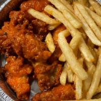 Chicken Wings with French Fries · Fried chicken wings. Choose Spicy, BBQ, or plain. Served with French fries.