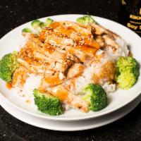 Rice Bowl · Grilled meat on top of steamed rice, served with steamed broccoli and teriyaki sauce on top. 