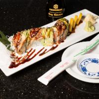 5. Black Dragon Roll · 8 pieces. Snow crab roll topped with eel and avocado.