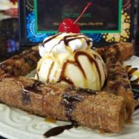 Churros · 2 deep fried churros served with chocolate dipping sauce. 