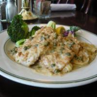 Chicken Piccata Lunch · Breast of chicken cutlets breaded and pan-fried in lemon, butter, wine and capers. Served wi...